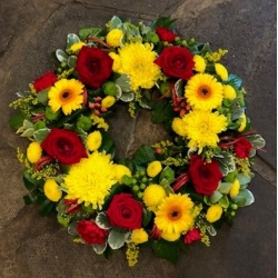 Red, Yellow & Green Wreath - same day or named day delivery - Rushes Florist